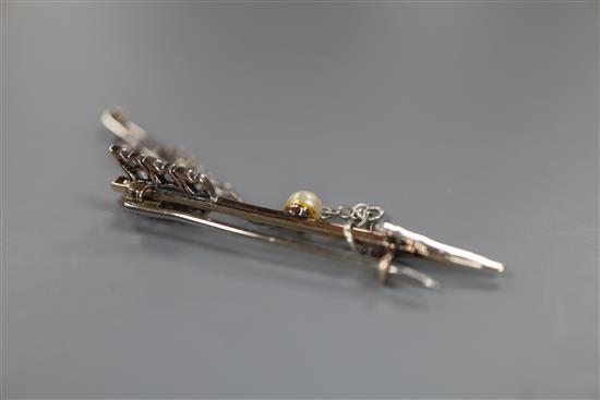 A Victorian yellow metal, rose cut diamond and pearl set arrow brooch, 45mm, gross 2.4 grams, in fitted box.